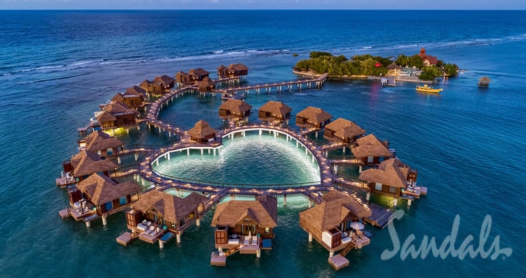 Coastal Vibe Travel - Sandals Weddings - a circular shaped fountain in the middle of a body of water