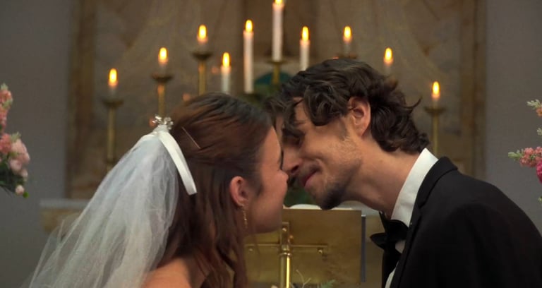 a man and woman kissing in a church