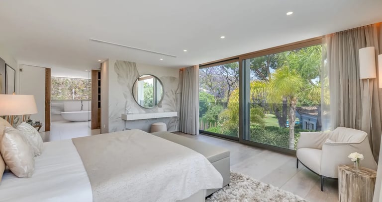 Bright bedroom at Villa Serenity with terrace and large windows