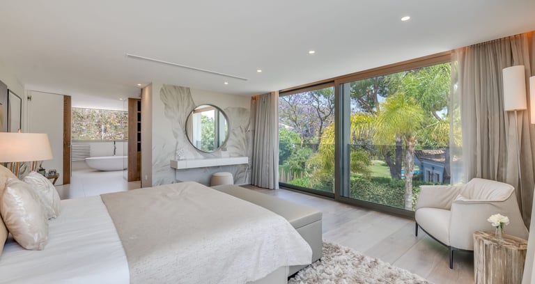 Contemporary designer suite at Villa Serenity, offering serene views of the lush gardens