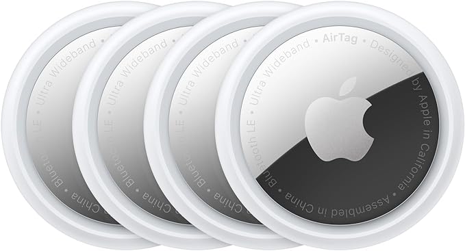 a group of four apple airtags