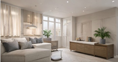 Modern minimalist living room with a beige sectional sofa, wooden dresser, and green potted plants.
