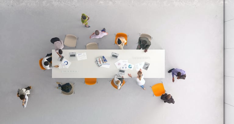 Ceiling view of conference table and employees