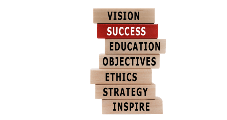 Wooden blocks stacked up highlighting organisational aims and with success in red