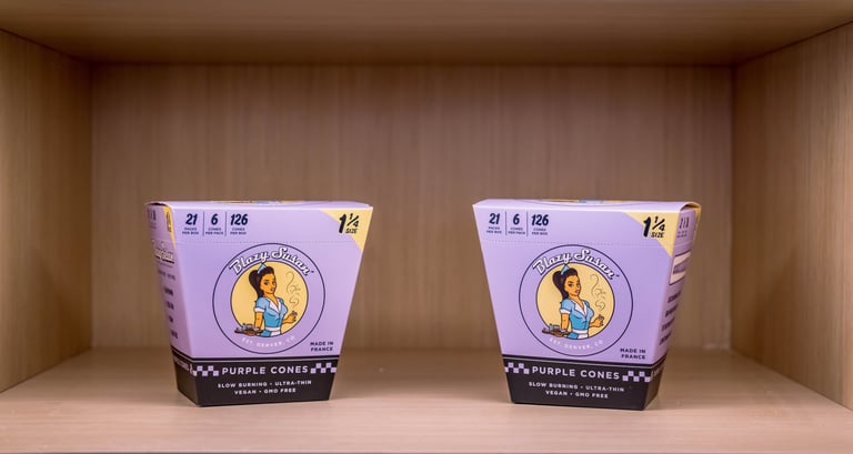 two cups of dispensary items on a shelf