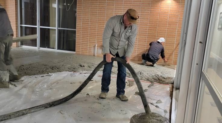 Pumping concrete through a hose