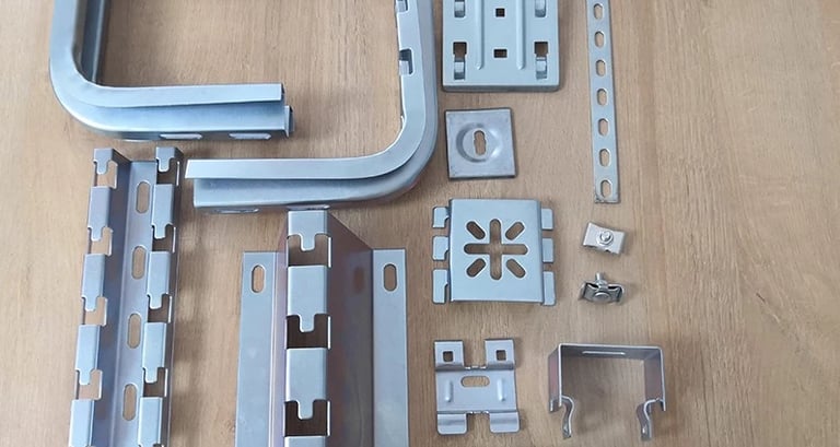 a variety of metal parts fittings of wire mesh cable tray