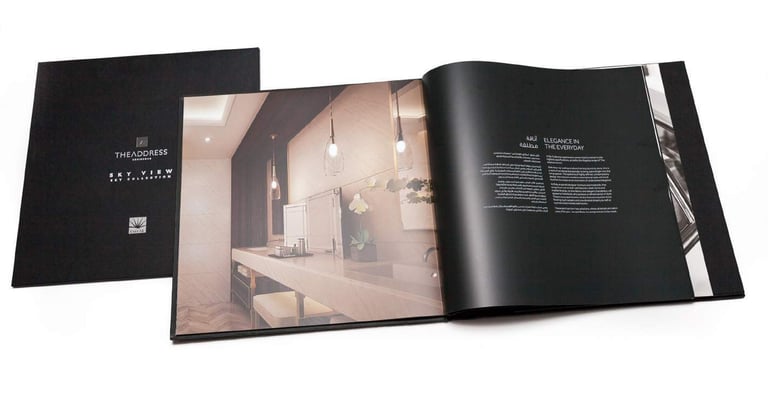 a book opened to show a book with a picture of a bathroom