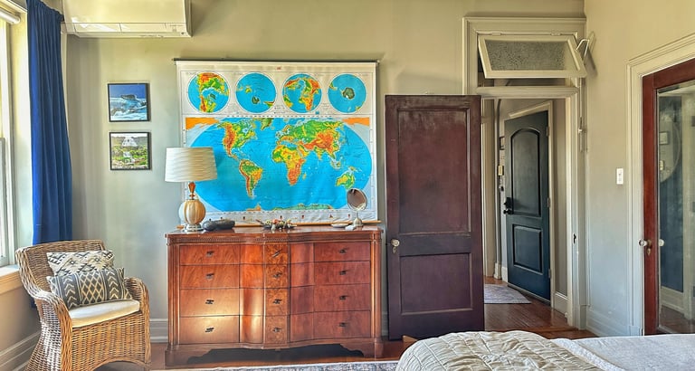 map of world in bedroom of 2123 rivermont apartments