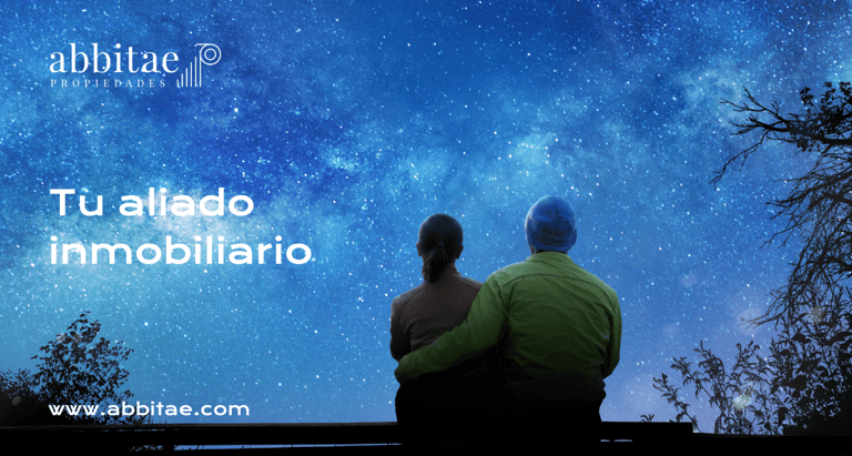 una pareja sentada en un banco mirando las estrellas