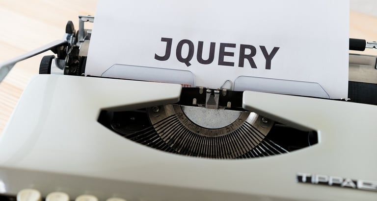 a typewriter typing JQUERY