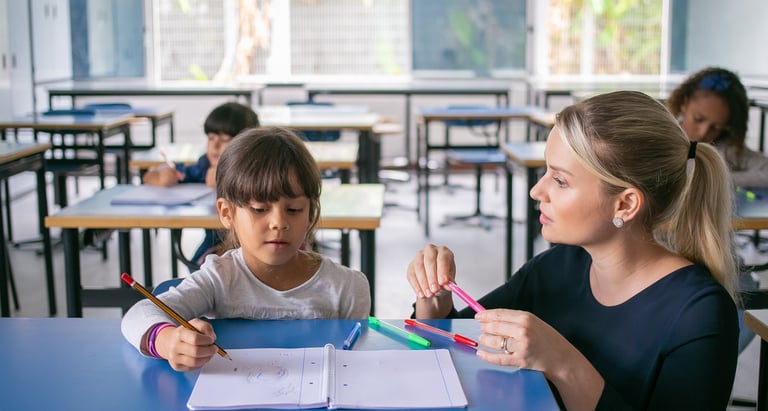 a woman and a child are sitting at a table