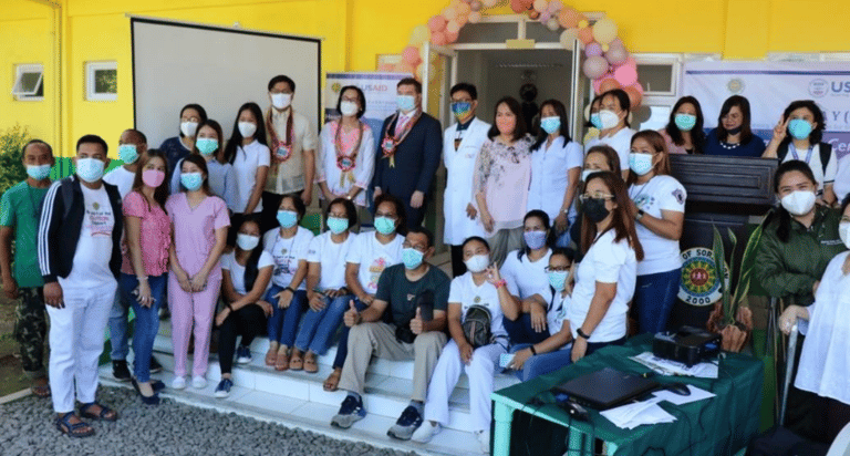 a group of people wearing masks on a stage