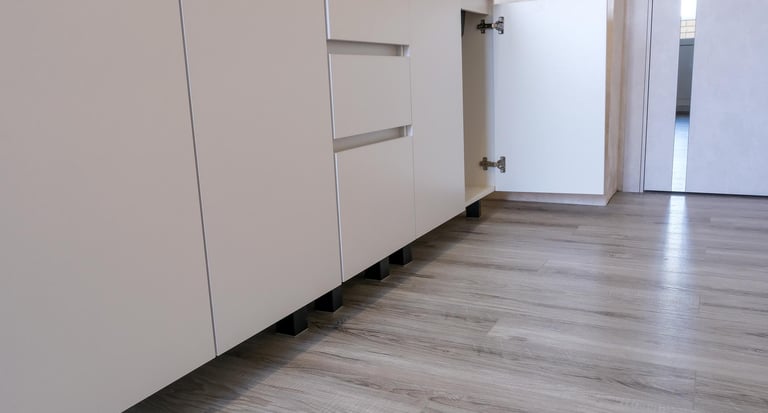 Laminate wood-look flooring installed in a modern kitchen.