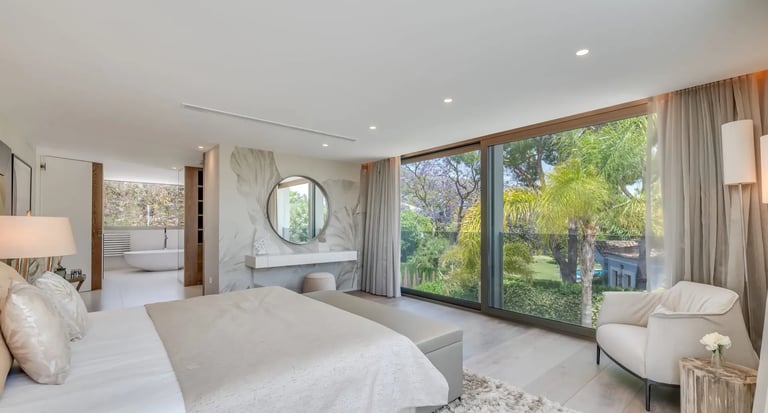 Bright bedroom at Villa Serenity with terrace and large windows