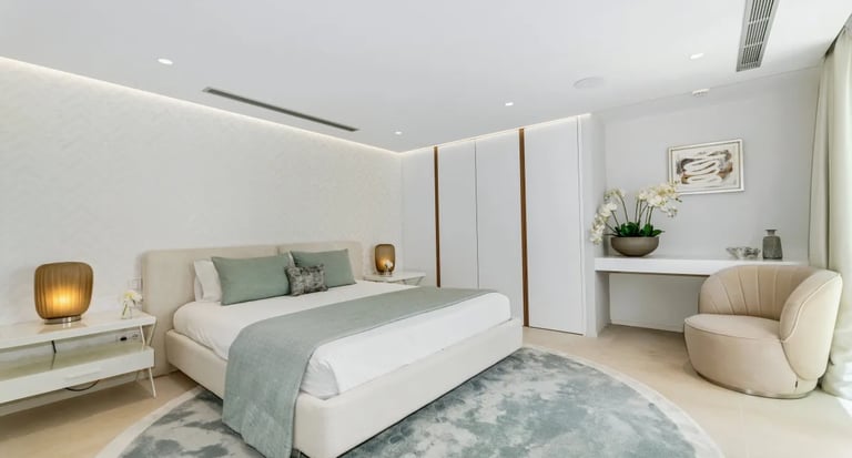 Stylish bedroom at Villa Serenity with soft neutral palette