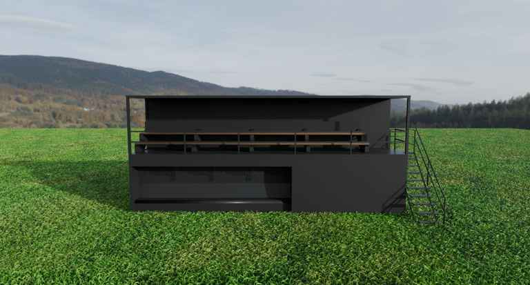 Módulo modular de dos niveles con graderío superior y escalera exterior, vista frontal