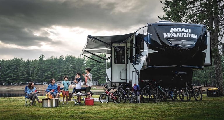 a group of people sitting around a campervan