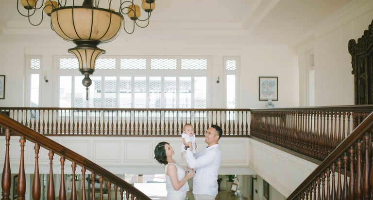 family portrait at Rumah Luwih Bali grand staircase