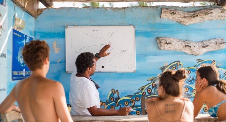 a scuba duka instructor briefing divers