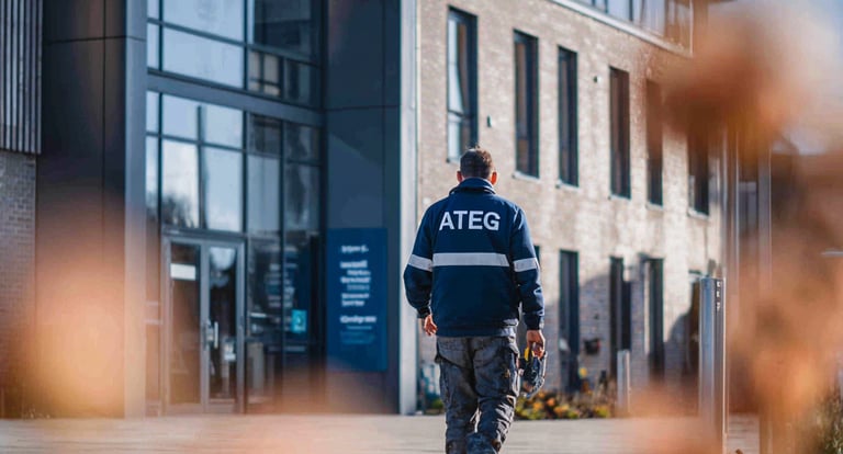 An IT engineer walking towards a school