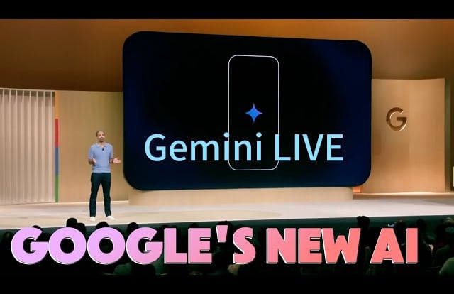 a man standing on a stage with a giant screen