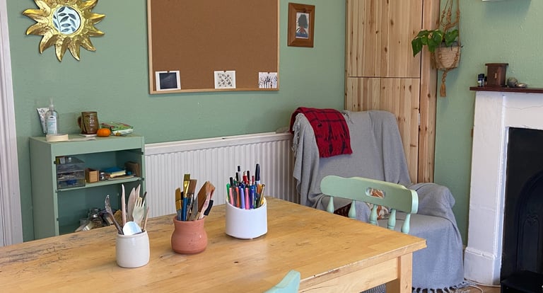 A photo of an art room with worktable