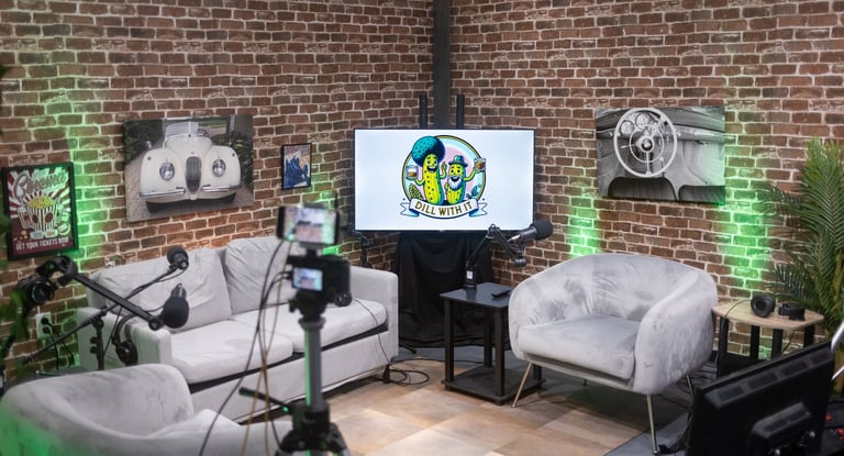 A brick living room podcast set that seats 4 people.  Photos can be changed,  your logo on the tv