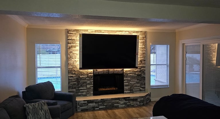 a living room with a television and a couch