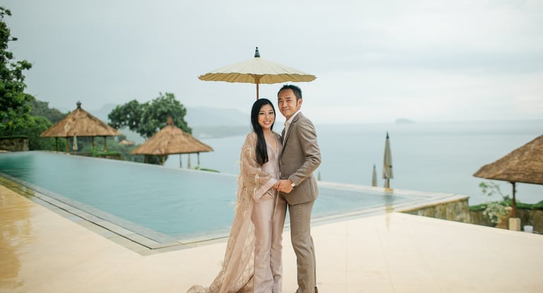 Elegant prewedding couple at Amankila infinity pool in Karangasem East Bali