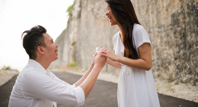 Surprise proposal moment with couple at Melasti Beach Bali