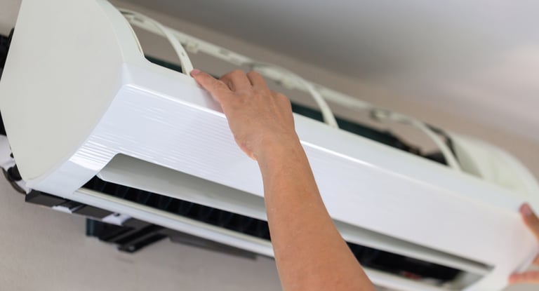 a person holding a white air conditioner , aprende con los mejores ,