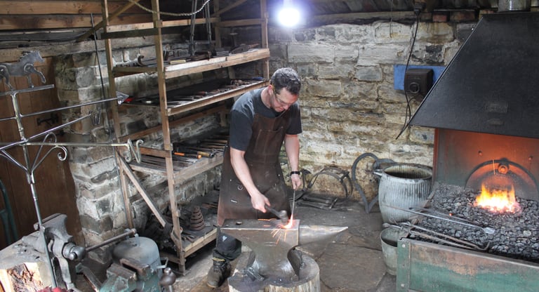 Paul working on a piece of metal