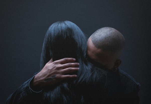 man and woman embracing to show understanding and closeness