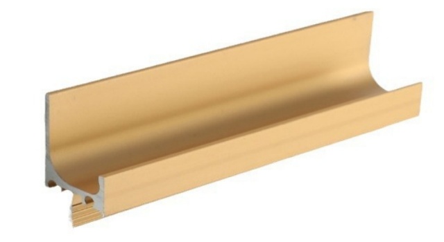 Aluminum L-shape groove pull handle installed on a white cabinet edge, showing recessed design and anti-slip inner edge