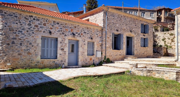 a stone building with a stone wall and a stone wall