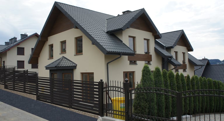 a house with a fenced in area with a fenced in area