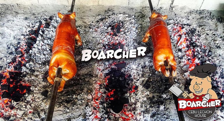 2 lechons being roasted in a roasting pit