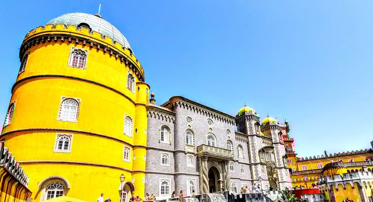 Vibrant red and yellow toweres of Pena palace a UNESCO world heritage castlein the hills of Sintra e