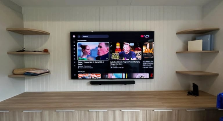 Professional 85 inch LG OLED TV wall mount installation with floating shelf in Brighton Melbourne
