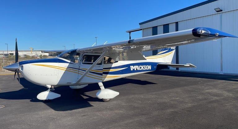 a small plane parked in front of a building