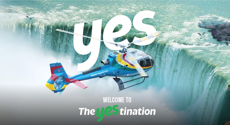 Niagara Helicopters tour flying over the mist of Horseshoe Falls at Niagara Falls.