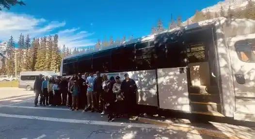 Moraine Lake and Lake Louise day tour shuttle under blue skies