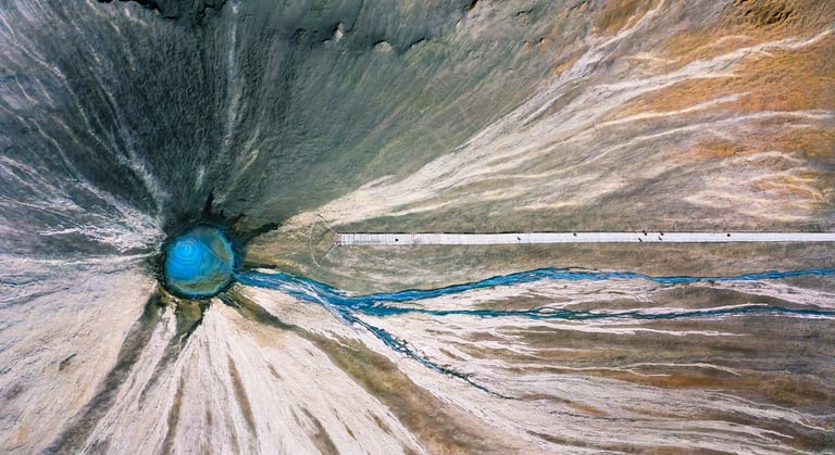 a large blue hole in the middle of a large hole . arbab naimat kasi , balochistan , Chandragup