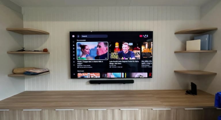 Professional 85 inch LG OLED TV wall mount installation with floating shelf in Brighton Melbourne