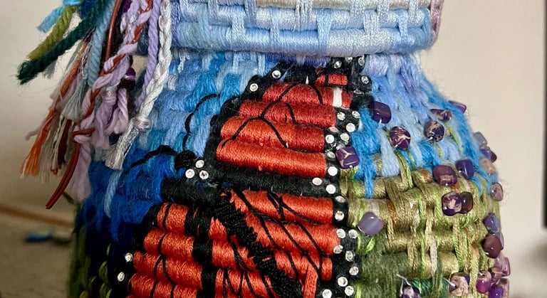 Coiled fiber basket with monarch butterfly design by Julie Curson.
