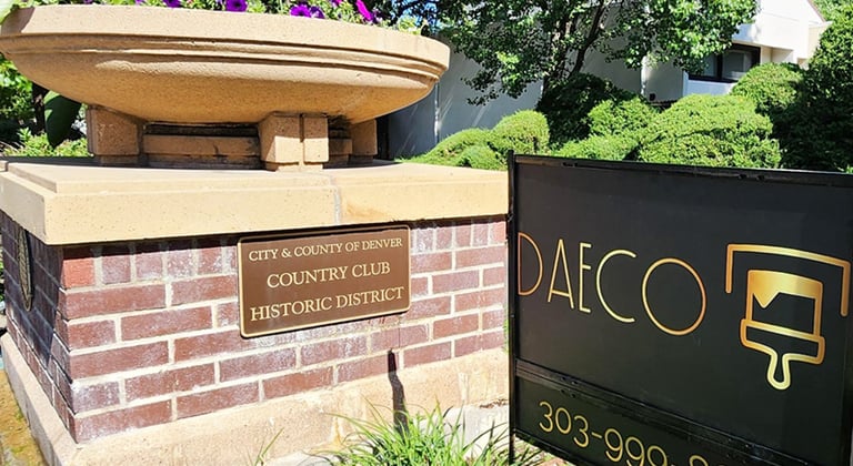 a fountain fountain with a fountain in front of a brick building