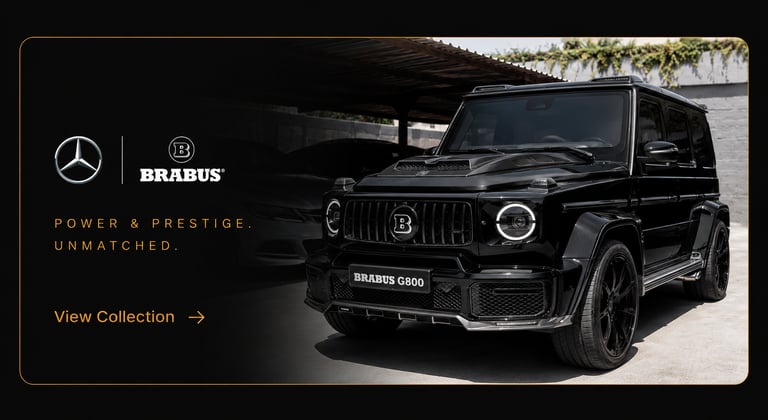 Custom black Brabus G800 Mercedes-Benz G-Wagon luxury SUV in a showroom with premium branding.