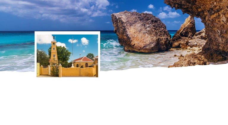 Vista de Kralendijk com praia ao fundo e o centro colorido em destaque.