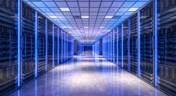 Modern data center aisle with blue server racks, representing cloud engineering infrastructure